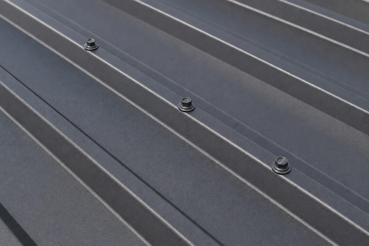 Close-up of exposed fastener metal roof panels