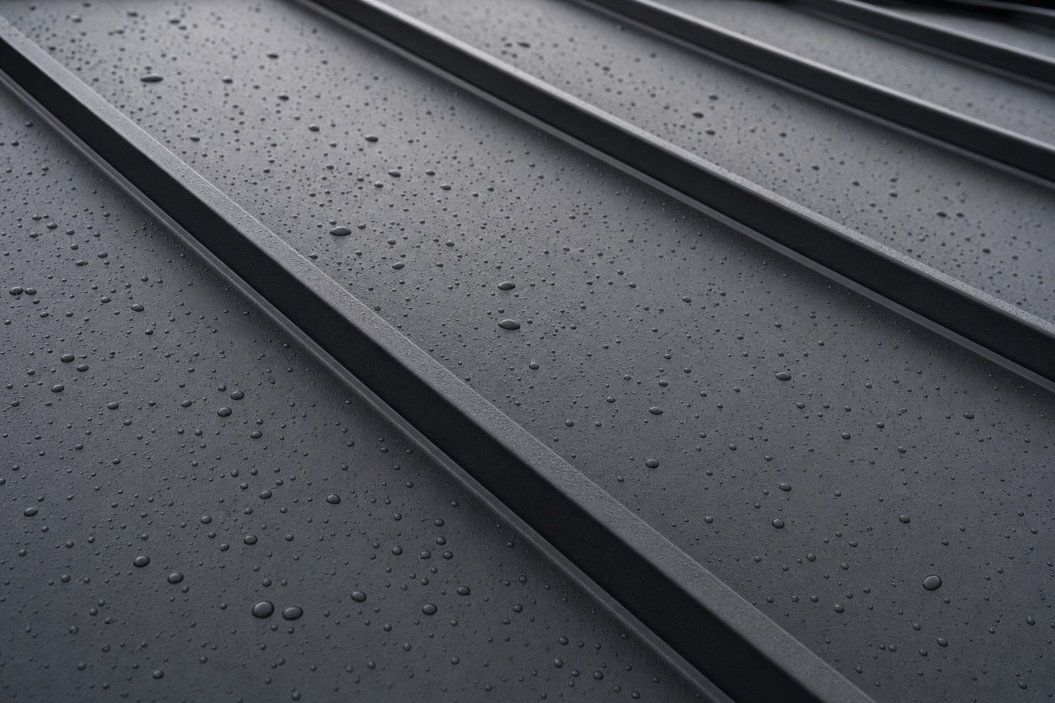 Close-up of matte black standing seam metal panels